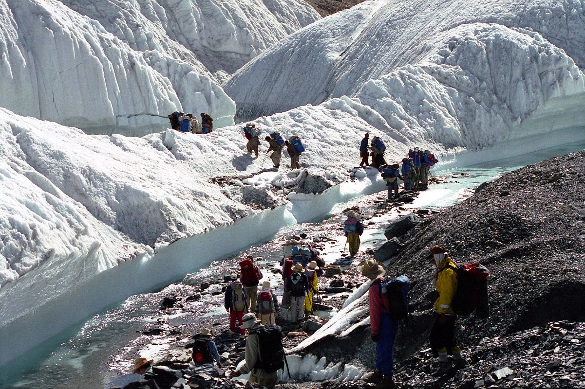 02 Crossing A Small River On The Upper Baltoro Glacier We intermixed with a Japanese Gasherbrum expedition to cross a small stream in a part of the Upper Baltoro Glacier where you realize that you are in fact trekking on a real glacier beneath the rubble.